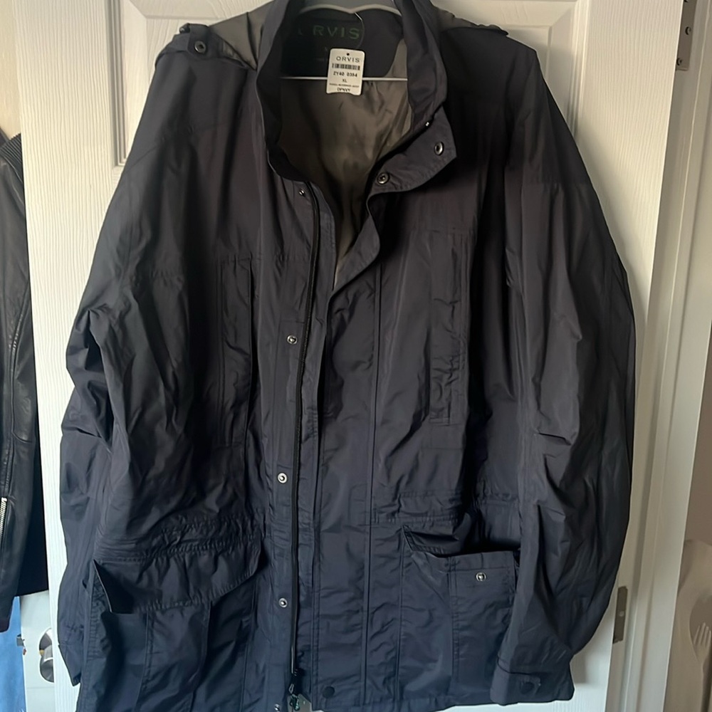 Brand new w tags Orvis deep blue w/ hood & bag to roll into. XL. Perfect gift.